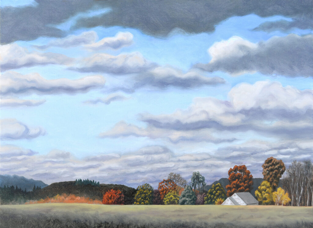A medium-size realistic naturalistic landscape oil painting: the bottom fifth of the canvas is a compressed landscape of dark, distant hills and brightly-colored autumn trees of many different kinds and colors running along the crest of a field, behind which a white house in bad need of painting hides, all of this commanded overhead by running troops of peach-tinted clouds accompanied by their purple undersides, sailing in front of a turquoise and cobalt sky, the top four-fifths of the painting.