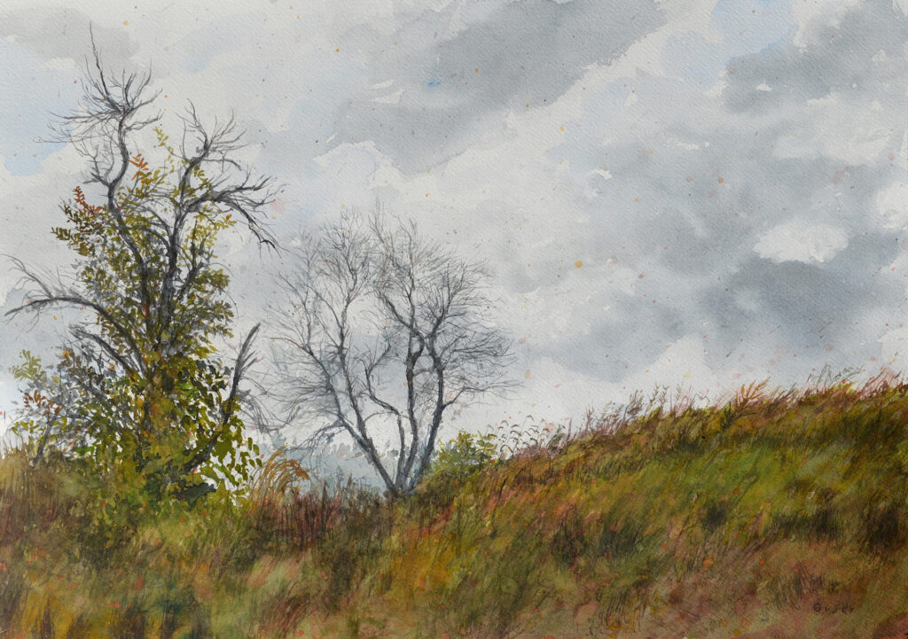A medium-size watercolor painting: a grassy hill rooted by two trees, one stunted, twisted, and covered in leafy vines, the other tall and bare, all beneath a cloudy sky, in tans, greens, reds, browns, grays, and blues